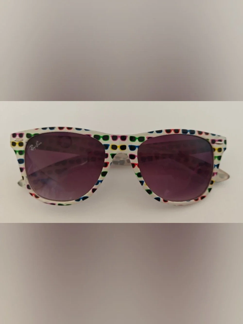 Ray-Ban Wayfarer Special Series #4 white frame covered in colorful sunglasses